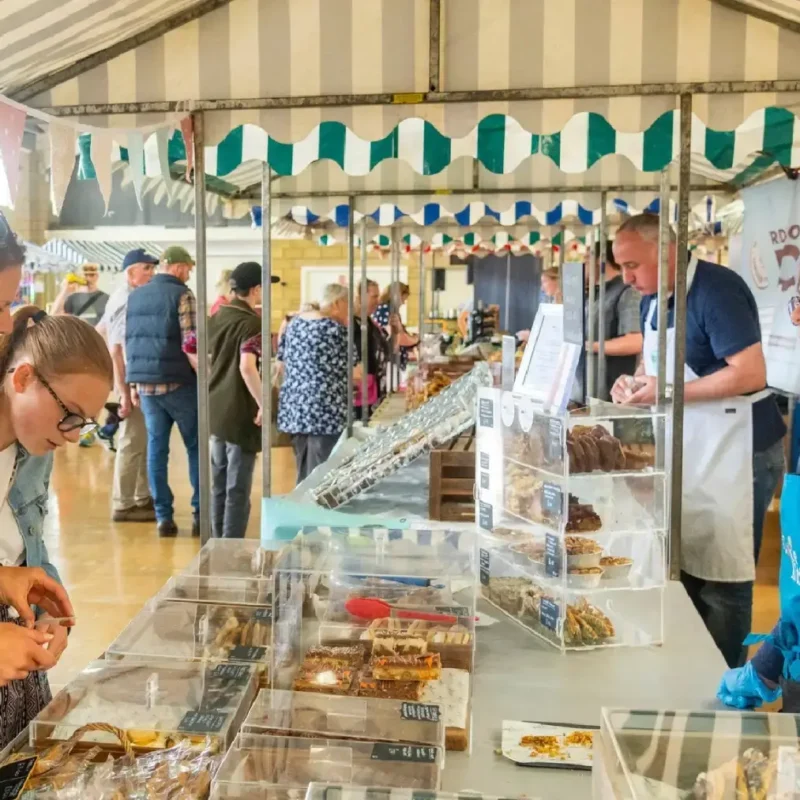 farmers market stalls and customers