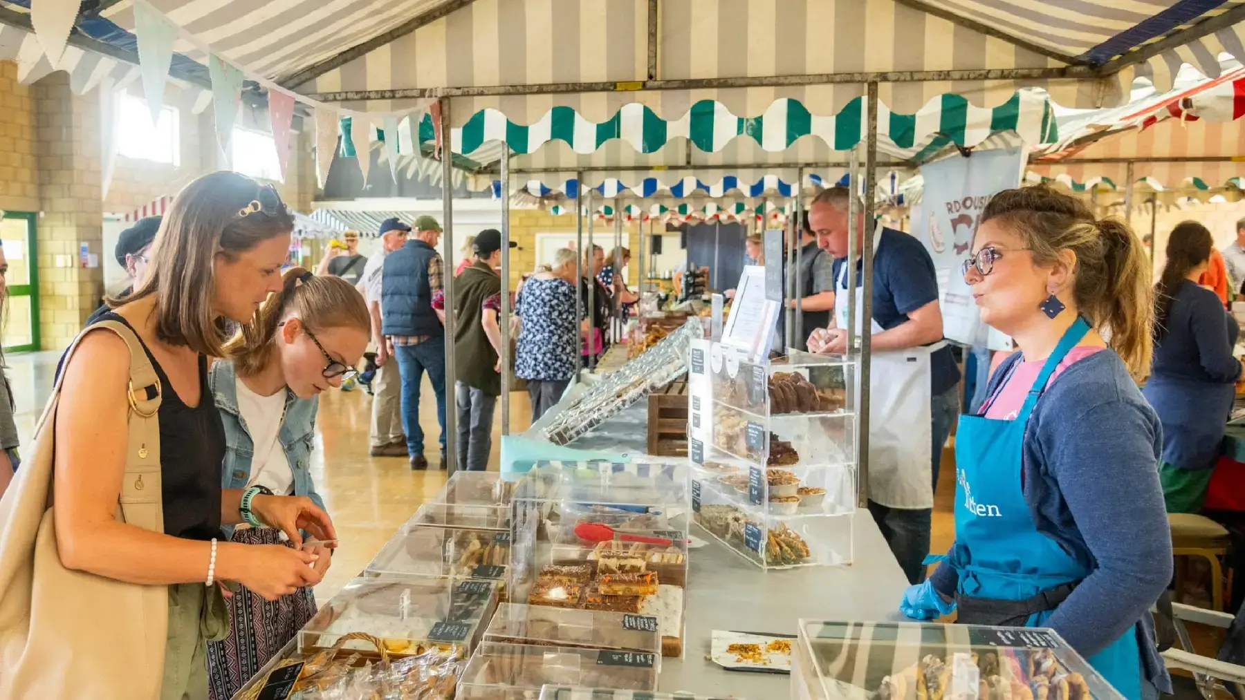 farmers market stalls and customers